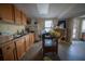 Kitchen area with wood cabinets and a double sink at 633 Duncan Rd, Oxford, GA 30054