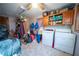 Laundry room with washer, dryer and storage cabinets at 633 Duncan Rd, Oxford, GA 30054