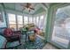 Relaxing screened porch with wicker furniture and view of the backyard at 633 Duncan Rd, Oxford, GA 30054