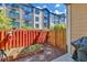 Small fenced backyard with raised garden bed and grill at 1037 Emory Parc Pl, Decatur, GA 30033