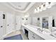 Elegant bathroom boasts double vanity, large mirror, and access to bedroom at 1037 Emory Parc Pl, Decatur, GA 30033