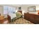 Cozy bedroom with hardwood floors, dresser, and large window at 1037 Emory Parc Pl, Decatur, GA 30033
