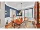 Elegant dining room boasts a large table, hardwood floors, and a stunning chandelier at 1037 Emory Parc Pl, Decatur, GA 30033