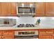 Modern kitchen features gas cooktop, built-in oven, and microwave at 1037 Emory Parc Pl, Decatur, GA 30033