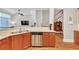 Kitchen with island, double sinks, dishwasher, and hardwood floors at 1037 Emory Parc Pl, Decatur, GA 30033