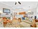 Open living room with fireplace and view into the kitchen at 1037 Emory Parc Pl, Decatur, GA 30033