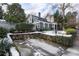 Charming blue house with stone wall and snowy landscaping at 217 Westminster Dr, Atlanta, GA 30309