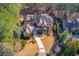 Luxury home nestled on a wooded lot with circular driveway at 922 Little Darby Ln, Suwanee, GA 30024