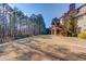 Spacious backyard with mature trees and home view at 922 Little Darby Ln, Suwanee, GA 30024