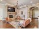 Spacious basement with stone fireplace, hardwood floors, and comfortable seating at 922 Little Darby Ln, Suwanee, GA 30024