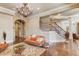 Open concept basement with stone fireplace and comfortable seating at 922 Little Darby Ln, Suwanee, GA 30024