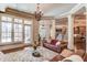Spacious basement with leather sofas, a stone fireplace and hardwood floors at 922 Little Darby Ln, Suwanee, GA 30024