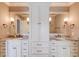 Double vanity bathroom with granite countertops at 922 Little Darby Ln, Suwanee, GA 30024