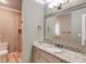Bathroom with granite vanity and a large mirror at 922 Little Darby Ln, Suwanee, GA 30024
