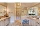 Elegant bathroom with double vanities, a large mirror, and a spacious layout at 922 Little Darby Ln, Suwanee, GA 30024