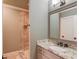 Bathroom with granite vanity and a glass shower at 922 Little Darby Ln, Suwanee, GA 30024