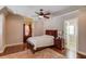 Bedroom with hardwood floors and a ceiling fan at 922 Little Darby Ln, Suwanee, GA 30024