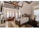 Luxurious main bedroom with a fireplace, hardwood floors, and plenty of natural light at 922 Little Darby Ln, Suwanee, GA 30024