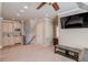Bonus room with wet bar, TV, and ample space at 922 Little Darby Ln, Suwanee, GA 30024