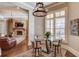 Basement breakfast area with glass table and four chairs at 922 Little Darby Ln, Suwanee, GA 30024