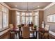 Formal dining room with large windows & chandelier at 922 Little Darby Ln, Suwanee, GA 30024