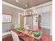 Formal dining room with chandelier and hardwood floors at 922 Little Darby Ln, Suwanee, GA 30024