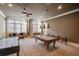 Game room features a pool table, air hockey, and comfortable seating at 922 Little Darby Ln, Suwanee, GA 30024