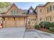 Two-car garage with attached covered entryway at 922 Little Darby Ln, Suwanee, GA 30024