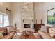 Spacious Gathering room with stone fireplace and hardwood floors at 922 Little Darby Ln, Suwanee, GA 30024