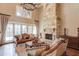 Spacious Gathering room with stone fireplace and hardwood floors at 922 Little Darby Ln, Suwanee, GA 30024