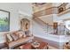 Gathering room with hardwood floors and stone fireplace at 922 Little Darby Ln, Suwanee, GA 30024