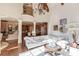Spacious great room showcases hardwood floors, a high ceiling, and views into the kitchen at 922 Little Darby Ln, Suwanee, GA 30024