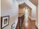 Long hallway with hardwood floors and an ornate railing at 922 Little Darby Ln, Suwanee, GA 30024