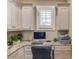 Functional home office with granite countertop and built-in cabinetry at 922 Little Darby Ln, Suwanee, GA 30024