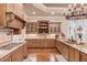 Gourmet kitchen features granite counters, custom cabinetry, and high-end appliances at 922 Little Darby Ln, Suwanee, GA 30024