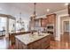 Open kitchen features two islands with granite and ample cabinetry at 922 Little Darby Ln, Suwanee, GA 30024