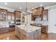 Large kitchen island with granite countertops is perfect for entertaining at 922 Little Darby Ln, Suwanee, GA 30024