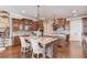 Gourmet kitchen boasts granite countertops, custom cabinetry, and a large island at 922 Little Darby Ln, Suwanee, GA 30024