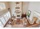 Spacious living room with stone fireplace, high ceilings, and ample natural light at 922 Little Darby Ln, Suwanee, GA 30024