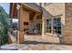 Large covered patio with seating area, fireplace, and built-in TV at 922 Little Darby Ln, Suwanee, GA 30024