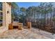 Outdoor patio with built-in grill and wooded views at 922 Little Darby Ln, Suwanee, GA 30024