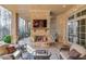 Cozy patio with fireplace, seating, and stone accents at 922 Little Darby Ln, Suwanee, GA 30024