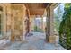 Covered stone porch with flagstone flooring at 922 Little Darby Ln, Suwanee, GA 30024