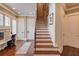 Grand staircase with ornate railing, leading to the upper level at 922 Little Darby Ln, Suwanee, GA 30024