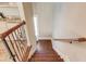 Wooden staircase with metal railing leading to upper level at 922 Little Darby Ln, Suwanee, GA 30024