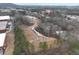 Aerial view of a residential development, showing the layout of homes and surrounding green spaces in the community at 179 Bluffington Way, Marietta, GA 30066