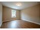 Well-lit bedroom featuring hardwood floors and a large window at 179 Bluffington Way, Marietta, GA 30066