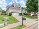 Two-story house with attached garage and manicured lawn at 485 Shelli Ln, Roswell, GA 30075