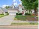 Two-story house with attached garage and manicured lawn at 485 Shelli Ln, Roswell, GA 30075