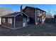Back of house with additional building and fenced yard at 3709 Charlotte Dr, Rex, GA 30273